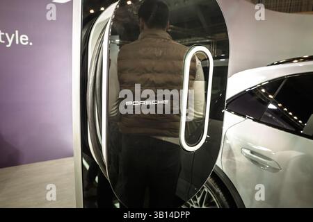 BELGRADE, SERBIA - MARCH 21, 2025: Logo of Porsche on rapid EV wallbox, electric car charger for Porsche electric vehicles. Porsche is a German car ma Stock Photo