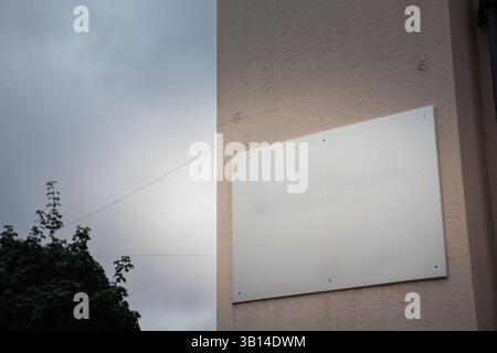 Blank rectangular grey signboard on an exterior wall of an office building in Croatia, ready for commercial use or business identification as an empty Stock Photo