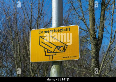 Utrecht, the Netherlands. 8 March 2025. Cameratoezicht: Surveillance camera sign on a pole. Stock Photo