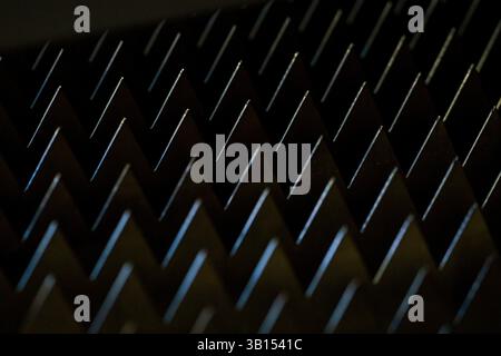 a  macro sharp metal teeth, total black background, closeup steel metal triangles, metalworking industrial screensaver, Stock Photo