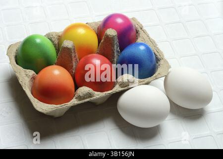 Colourful Easter eggs in packaging, Easter celebration Stock Photo