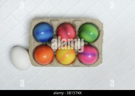 Colourful Easter eggs in packaging, dyed eggs Stock Photo