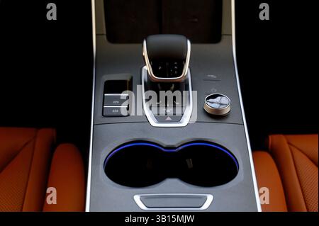Selector automatic transmission with leather in the interior of a modern expensive car. Black and brown leather car. Modern automatic gearbox. Close u Stock Photo