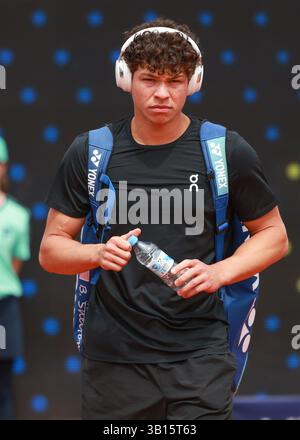 American tennis player Ben Shelton (USA) walking on court wearing headphones at the 2025 BMW Open tournament in Munich,Bavaria,Germany. Stock Photo