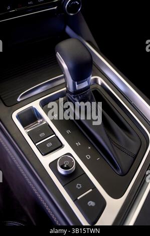 Selector automatic transmission with leather in the interior of a modern expensive car. Black and brown leather car. Modern automatic gearbox. Close u Stock Photo