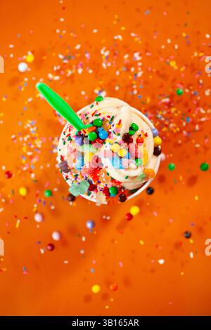 Looking down on frozen yogurt on orange background Stock Photo