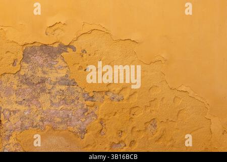 Yellow Peeling Paint on Old Wall Stock Photo