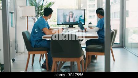 Nurses, doctors and computer with video call in meeting for online discussion and healthcare presentation. Medical employees, virtual training and Stock Photo