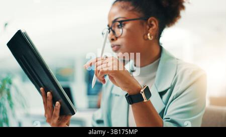 Tablet, stylus and woman in office with notes for web development, update or reading software review. Network, coding and programmer on digital app Stock Photo