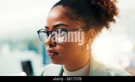 Black woman, programmer and software developer with glasses for new app or development at office. Female person, coder or AI designer with vision for Stock Photo