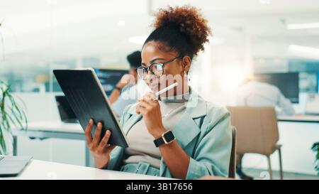 Tablet, thinking and woman in office with stylus for web development, update or reading software review. Network, coding and programmer on digital app Stock Photo