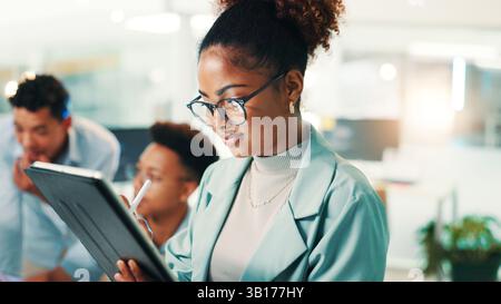 Programmer, woman and happy with tablet in office for writing code, web development and system maintenance. Programming, person and testing app with Stock Photo