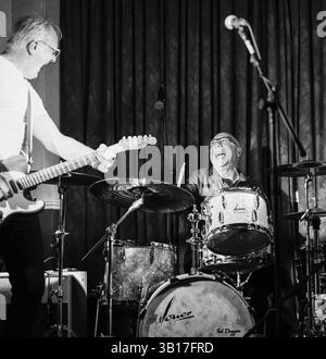 Henry Spinetti and Steve Walwyn share a laugh during a live gig. Stock Photo