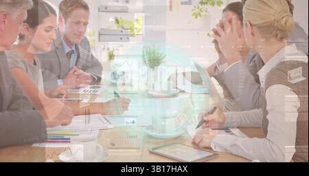 Image of clock and data over happy diverse businesspeople working Stock Photo