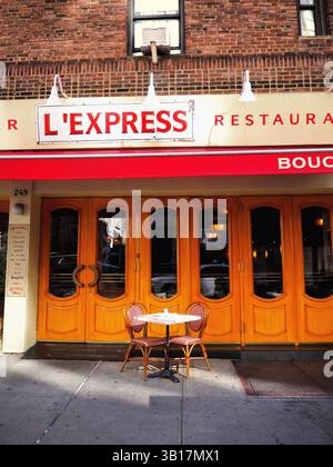 Empty restaurant table by the storefront in Manhattan on an autumn afternoon, New York Stock Photo