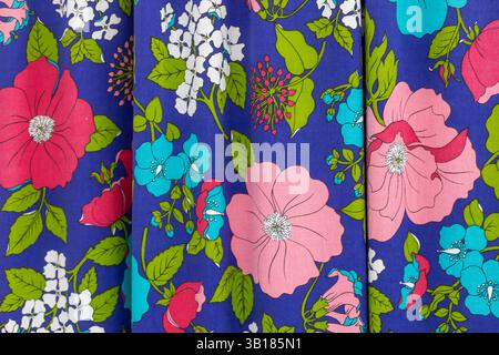 Colorful floral fabric pattern on violet background Stock Photo