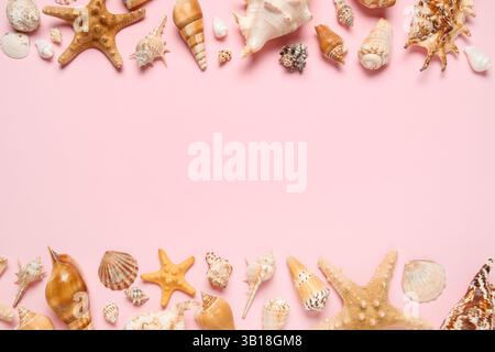 Many different seashells and starfishes on pink background Stock Photo