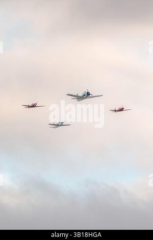 Propeller aircrafts flying in formation over the Dune du Pilat, France Stock Photo