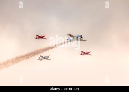 Propeller aircrafts flying in formation over the Dune du Pilat, France Stock Photo
