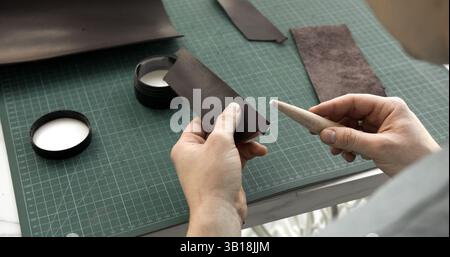 Preparing leather for edge finishing Stock Photo
