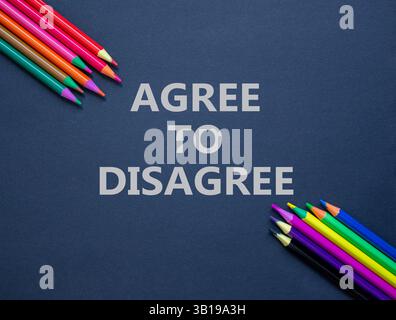 Agree to disagree symbol. Concept words Agree to disagree on beautiful black paper. Colored pencils. Beautiful black background. Business and agree to Stock Photo