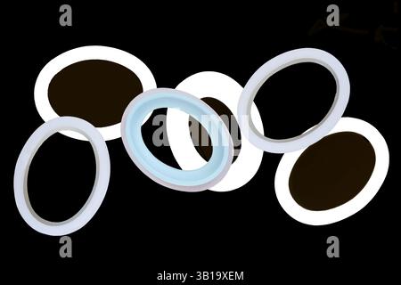 Photographic image has oval shape picture frames. Six isolated ovals for framing design show empty centers. All overlap with central one in blue gold. Stock Photo