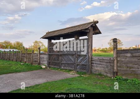 Old wooden gate on a clear spring day Stock Photo