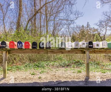 a large number of metal mail boxes in a row Stock Photo