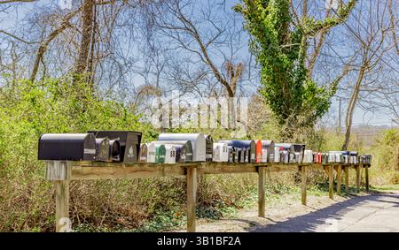 a large number of metal mail boxes in a row Stock Photo