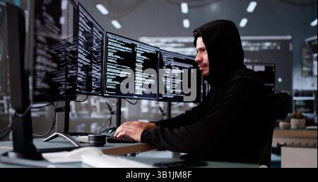 Hacker And Computer Data Breach. Cyber Risk Stock Photo
