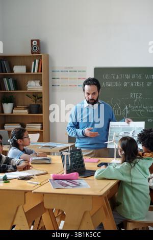 Teaching Students in Modern Classroom Setting Stock Photo