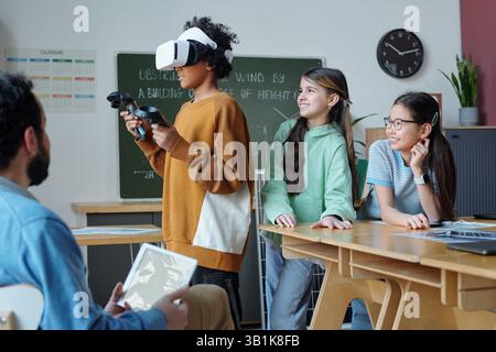 Students Experiencing Virtual Reality in Classroom Stock Photo