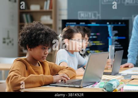 Engaging Students Participating in Digital Class Activities Stock Photo