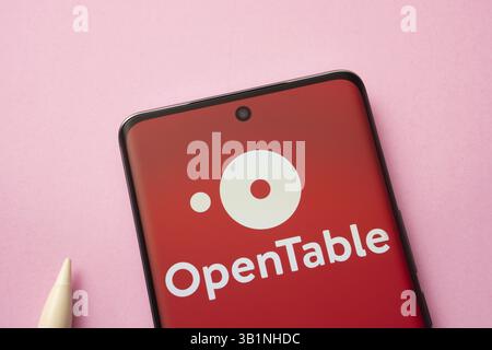 Dhaka, Bangladesh - 17 March 2025: The logo of the open table is displayed on a smartphone screen Stock Photo