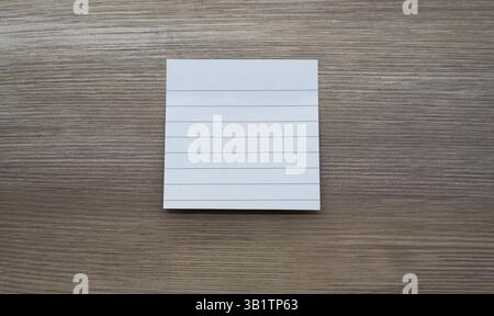 White stickers stuck on wooden table Stock Photo