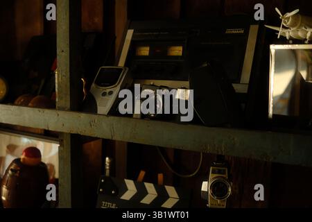 Close-up of old vintage cameras and retro radio displayed on a wooden shelf, Ko Kret, Thailand. Stock Photo