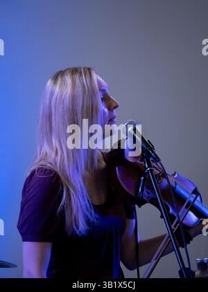 A female folk musician playing a fiddle, UK Stock Photo