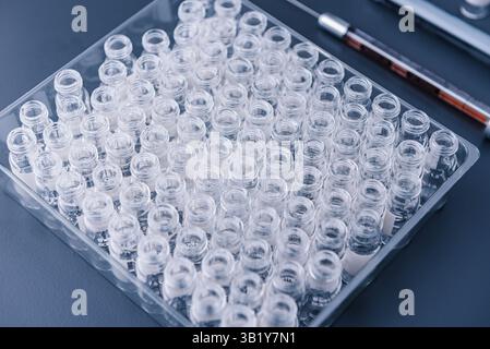 Close up view , empty glass vials in chemical laboratory. Science, medicine, experiment, chemistry, research and healthcare concept Stock Photo