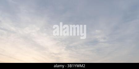 Beautiful morning or evening blue and orange sky with cloudy while sunsets or sunrises was taken at the sea used as natural background texture Stock Photo