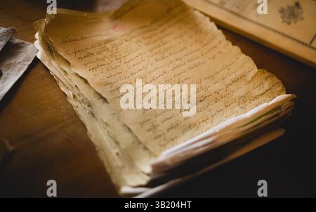 Vintage manuscripts and inkwell on the table Stock Photo