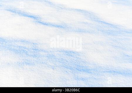 Fresh sparkling snow diagonal blue tone close-up, perfect as a winter season background or texture Stock Photo