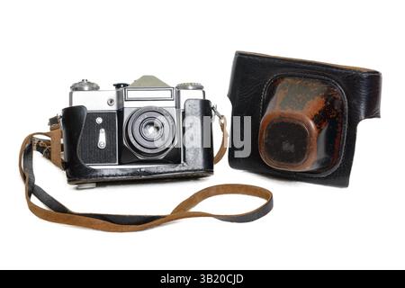 Vintage old film photo-camera in leather case on white background Stock Photo