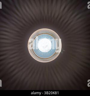 patterned light chandelier with light bulb on dark background Stock Photo