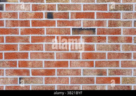Background from a bright red brick wall Stock Photo