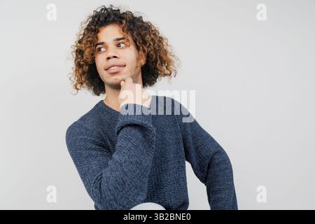 Portrait of young middle eastern man with curly hair Stock Photo