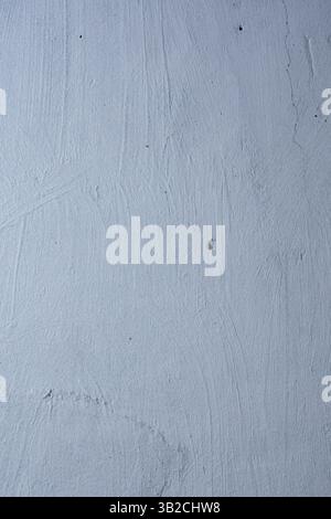 Textured blue wall with visible scratches and cracks Stock Photo