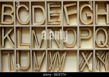 Wooden English alphabet letters arranged in cells, alphabet letters in ...