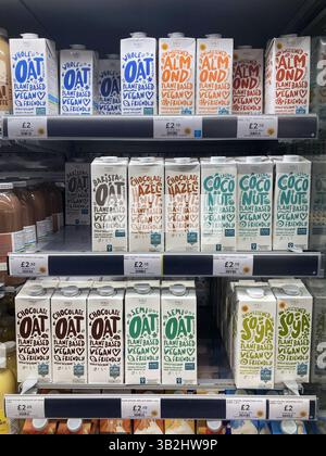 Plant Based Milk Carton for sale at Marks & Spencer in a chilled cabinet, UK. Varieties:Oat Milk, Almond Milk, Hazelnut Milk, Coconut Milk, Soya Milk Stock Photo