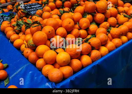 Oranges piled up for sale at the Kallidromiou farmers market in Exarchia, Athens, Greece. Stock Photo