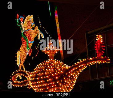 Illuminated Horse and Caballero with Aladdin's Lamp Neon Signs at The Entrance to Freemont East, Las Vegas, Nevada, USA Stock Photo